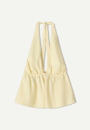 Haut à bretelles jaune avec une taille élastiquée, présentant un décolleté en V profond et des liens au cou. Texture en coton lisse.