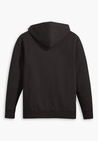 Zwarte hoodie met een zachte textuur, lange mouwen en een losse pasvorm. Heeft een eenvoudig, effen ontwerp zonder patronen of accenten.