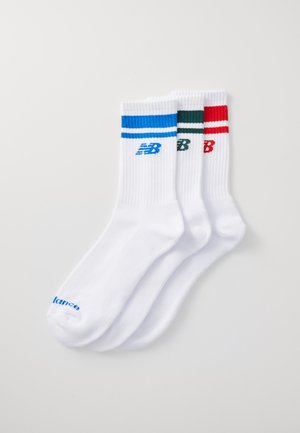 Three pairs of white athletic socks featuring colorful striped accents in blue, green, and red, with logos on the side.