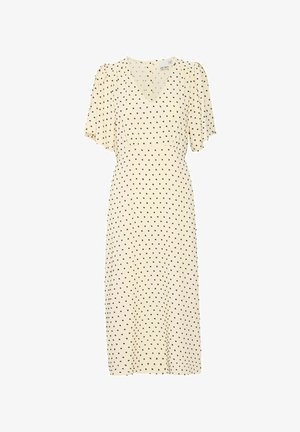 Kreemivärvi midi kleit mustade täppidega, lühikeste lehvivate varrukatega, V-kaelusega ja keha lähedalt istuva vöökohtadega. Sile tekstuur, põlvekõrgune.