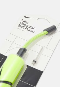 Nike Essential Ball Pump in bright green plastic with a black handle. Includes a needle for inflation. Packaged on a white card with graphics.