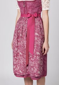 Pink floral-patterned dress with a fitted bodice, lace sleeves, and a waist ribbon. The skirt has a pleated design and a smooth texture.