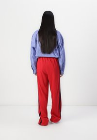 Gap Tall TRACK PANT - Tracksuit bottoms - modern red