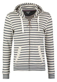 Felpa con cappuccio e zip di colore grigio chiaro con strisce verticali blu navy. Include lacci bianchi, due tasche frontali e polsini a costine.