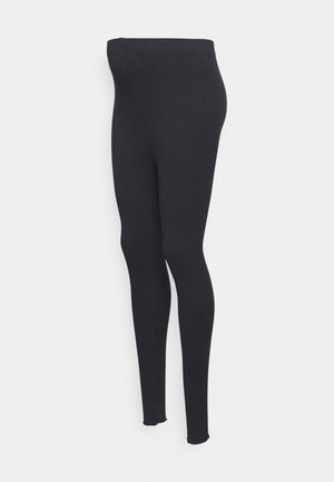 Leggings pretos com textura suave e design ajustado. Apresentam uma cintura alta e pernas afuniladas, que se estendem até o comprimento do tornozelo.