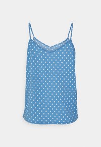 Haut sans manches bleu avec de fines bretelles et des pois blancs, présentant un décolleté en V et un tissu léger.