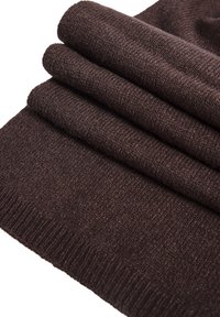 Brunt strikket stof, foldet, med en tekstureret overflade og ribbede kanter. Ensartet farve og finish hele vejen igennem. Blødt, varmt materiale.