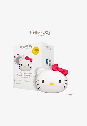 Brosse faciale sonique en forme de Hello Kitty avec un nœud rouge, présentée à côté d’une boîte blanche étiquetée pour un nettoyage et un raffermissement du visage de niveau professionnel.