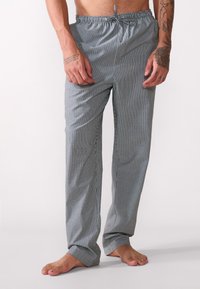 Pantaloni da pigiama a righe in grigio e bianco, realizzati in tessuto leggero, con una vita elastica e chiusura con cordino e orli a costine.