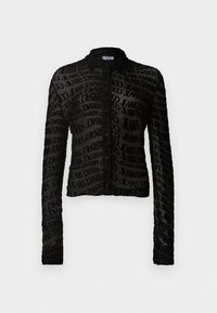 Black cropped jacket made of sheer fabric, featuring a repeated text pattern. It has long sleeves and a simple button closure at the front.