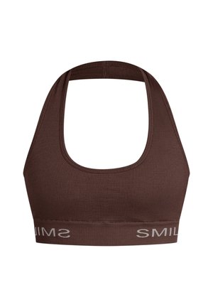 Soutien-gorge de sport marron à côtes avec des larges bretelles et un encolure arrondie. Présente un logo blanc "SMILE" en contraste sur la bande élastique.
