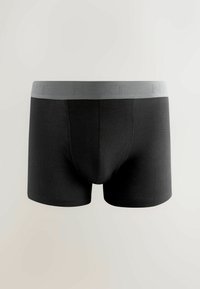 Boxer shorts neri in cotone con un elastico grigio embossato con "NEXT". Presentano una vestibilità aderente e una trama liscia.