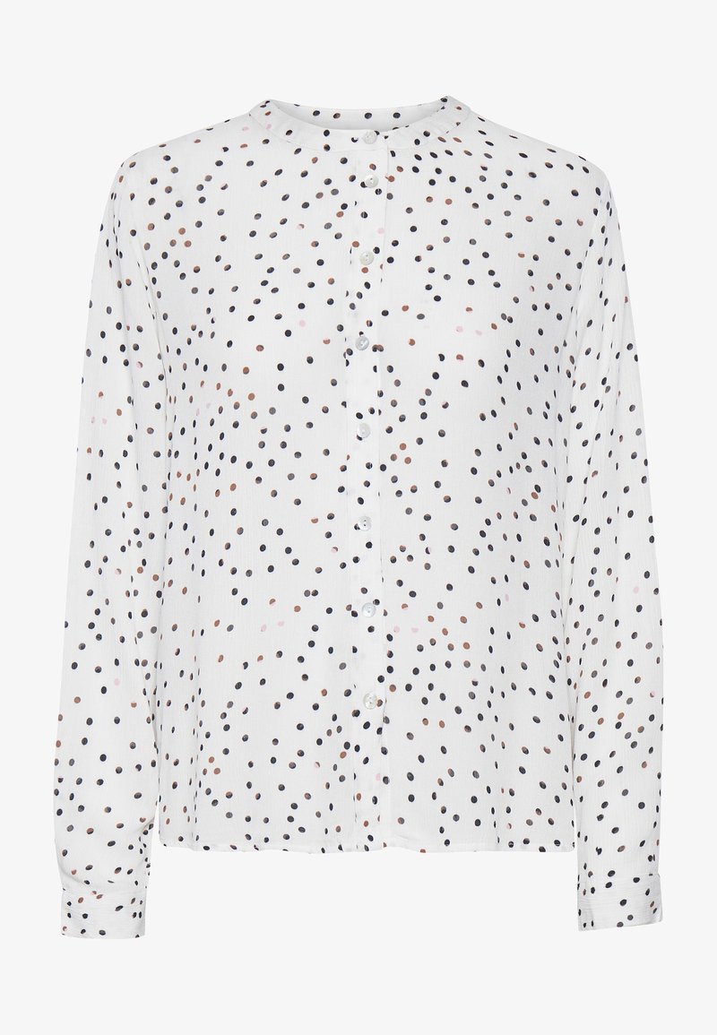 Blouse blanche à manches longues avec encolure ronde, fermeture à boutons sur le devant, et pois multicolores éparpillés en marine, rose et marron.