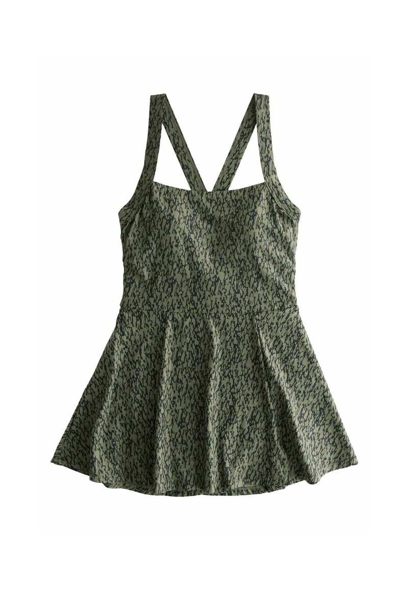 Grön ärmlös topp med en utsvängd kjol, med ett strukturerat mönster och korslagda band bak. Slät tyg med en figurnära bodice.