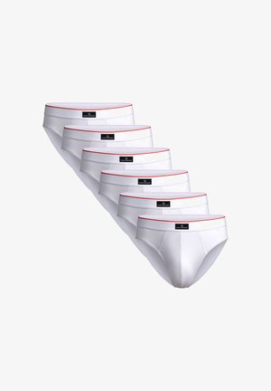 Valkoiset puuvillaiset bokserit, joissa on punainen vyötärönauha ja jokaisessa parissa musta merkkilätkä, aseteltuna riviin. Yhteensä kuusi paria.