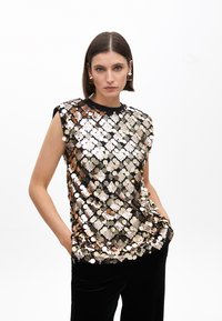 Black sleeveless top covered in varying sizes of shiny gold, silver, and bronze circular sequins, featuring a round neckline and relaxed fit.