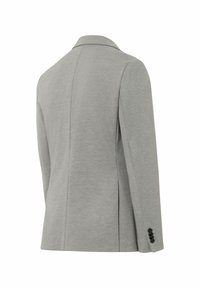 Veste tailleur grise au tissu lisse, dotée d'un col à revers, de poignets boutonnés et d'une coupe ajustée. Détail de fente au dos inclus.