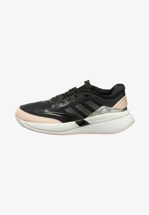 Schwarz-beiger Adidas-Laufschuh mit weißer dicker Sohle, schwarzen Schnürsenkeln, drei schwarzen Streifen an der Seite und gepolstertem Fersenkragen.