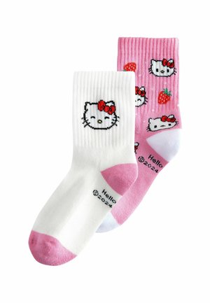 Calze a righe bianche e rosa con design di Hello Kitty; la calza bianca presenta il logo, mentre la calza rosa ha fragole e loghi nella parte superiore.