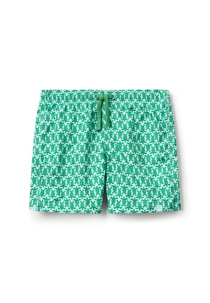 Grüne und weiße Badeshorts mit einem sich wiederholenden Schildkrötenmuster und einem verstellbaren grünen Kordelzugbund.