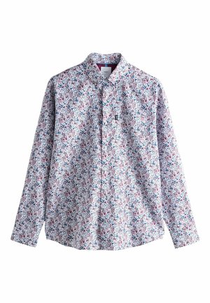 Balto garām piedurknēm krekls ar ziedu rakstu, kurā ir sarkanas, zilas un zaļas akcenti. Klasiska apkakle un pogājams priekšpuse. Kokvilnas materiāls.