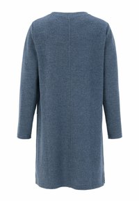 Langärmlige, gerippte Tunika in einem mittleren Blauton. Sie verfügt über einen runden Halsausschnitt und seitliche Schlitze am Saum für mehr Bewegungsfreiheit.