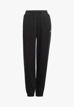 Pantalon de survêtement Adidas noir avec poignets élastiques, taille à cordon de serrage et les trois bandes emblématiques sur les côtés.