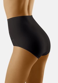 Slip neri a vita alta realizzati in tessuto morbido, con dettagli in pizzo sui lati e un design senza cuciture per garantire comfort.