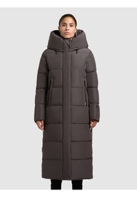 Padded long coat in dark gray with a high collar, detachable hood, two zippered side pockets, and a straight cut design.