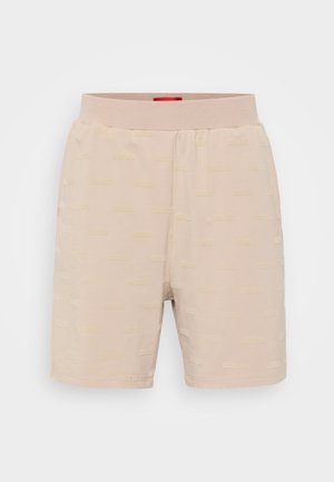 Shorts beige chiaro realizzati in tessuto morbido, con un motivo a logo in rilievo su tutta la superficie e una cintura elasticizzata per comfort.
