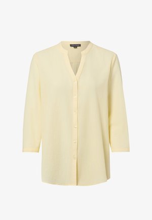 Jasnożółta koszula zapinana na guziki z długimi rękawami i dekoltem w kształcie litery V bez kołnierza, rozmiar 36, marki Franco Callegari.