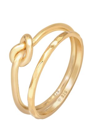 Deux bagues en or reliées, l'une avec un design de nœud et l'autre avec une texture martelée, toutes deux poinçonnées "925" à l'intérieur.