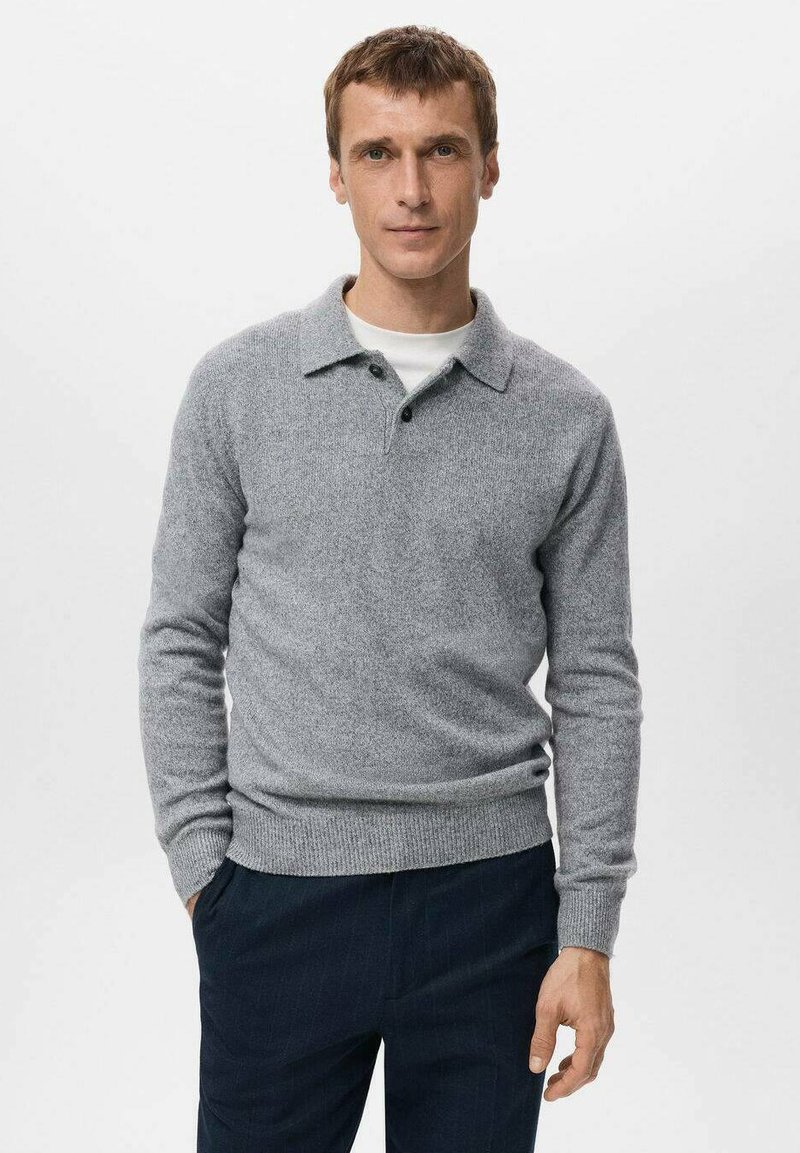 Gray knitted pullover with a collared neckline and two buttons, featuring long sleeves and a fitted waist, paired with dark trousers.