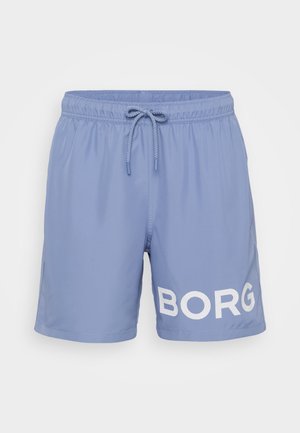 Lichtblauwe zwembroek gemaakt van soepel materiaal, voorzien van een elastische tailleband met een koord en een groot wit "BORG"-logo op één been.