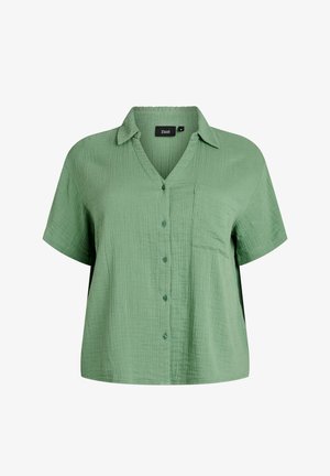 Kurzärmeliges, hellgrünes, strukturiertes Hemd mit Knöpfen, Kragen und Brusttasche, weiter Schnitt.