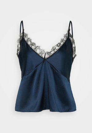 Mørkeblå satin camisole med sort blondekant langs V-halsen og stropperne. Løst fit med dekorative sømdetaljer.
