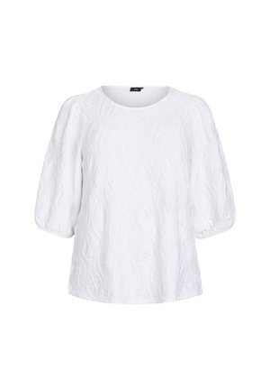 Haut blanc en tissu texturé, doté d'un col rond et de courtes manches bouffantes avec un motif en vagues.