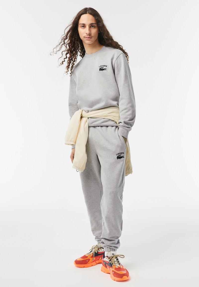 Lacoste Trainingsbroek lichtgrijs Lacoste Trainingsbroek lichtgrijs