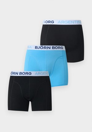 Tri pánske boxerky v čiernej a modrej farbe s bielymi pásikmi v páse, označené textom „BJÖRN BORG ARGENTINA“ modrou a námorníckou modrou farbou.