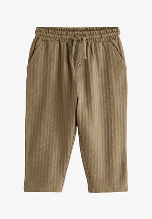 Beżowe spodnie o luźnym kroju z teksturowanym wzorem pasków, elastycznym pasem i sznurkiem do wiązania. Posiadają dwie boczne kieszenie i guzikowe detale.