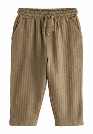 Beige relaxed-fit pants with a textured stripe pattern, elastic waistband, and drawstring. Features two side pockets and button detail.