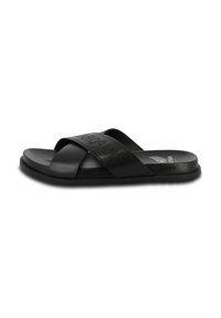 Black slide sandal featuring cross-strap design, made from smooth synthetic material, with textured sole and embossed brand logo.