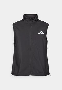 Chaleco sin mangas negro hecho de tela ligera, con un cuello alto y una cremallera frontal. Incluye un logo blanco de Adidas en el lado izquierdo.