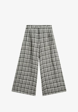 Wide-leg pants featuring a black and white plaid pattern, made from textured fabric with an elastic waistband for comfort.