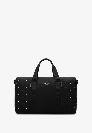 Schwarze Reisetasche mit buntem Punktmuster, robusten Griffen und seitlichem Reißverschluss. Verfügt über Logo-Akzente und texturierten Stoff.