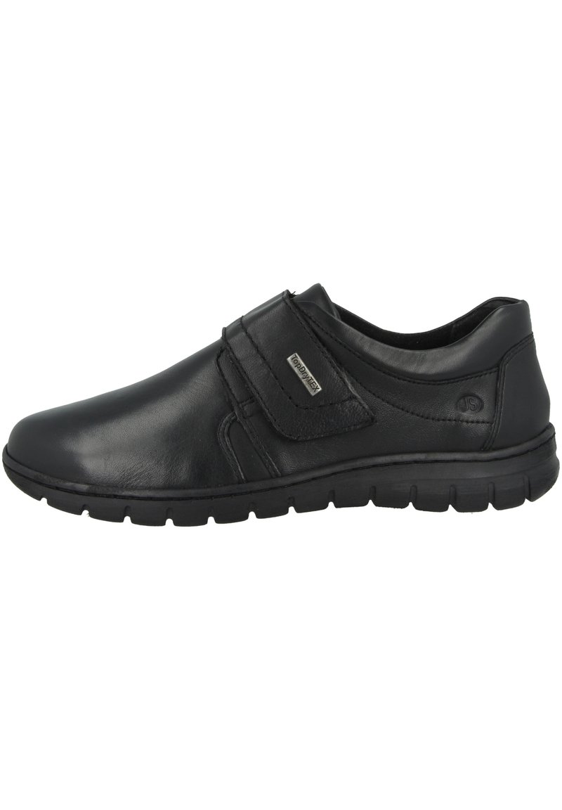 Schwarze Lederschuhe mit glatter Oberfläche, einem Klettverschluss, gepolstertem Schaft und flexibler Gummisohle.
