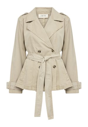 Beige bomullsblandad jacka med dubbelknäppt design, avtagbart bälte och axelklappar. Har uppvikta ärmar och en peplumslut.