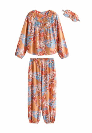 Long-sleeve top and elastic-waist pants set with orange, blue, and red mermaid and star patterns, shown with a matching sleep mask.