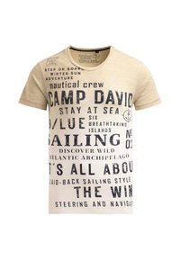 Beige cotton t-shirt featuring dark blue graphic text with nautical themes, crew and sailing motifs, round neck, and short sleeves.