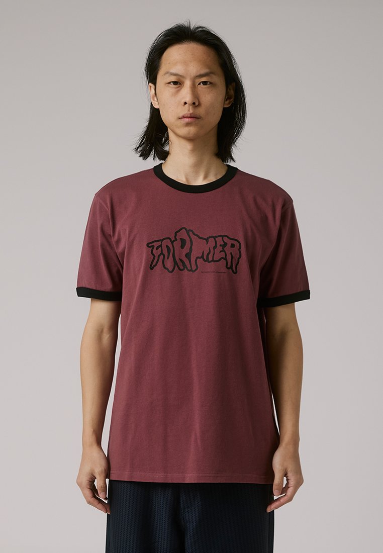 Maroon cotton t-shirt with black ribbed collar and sleeves. Features a bold black graphic text design on the front. Regular fit.